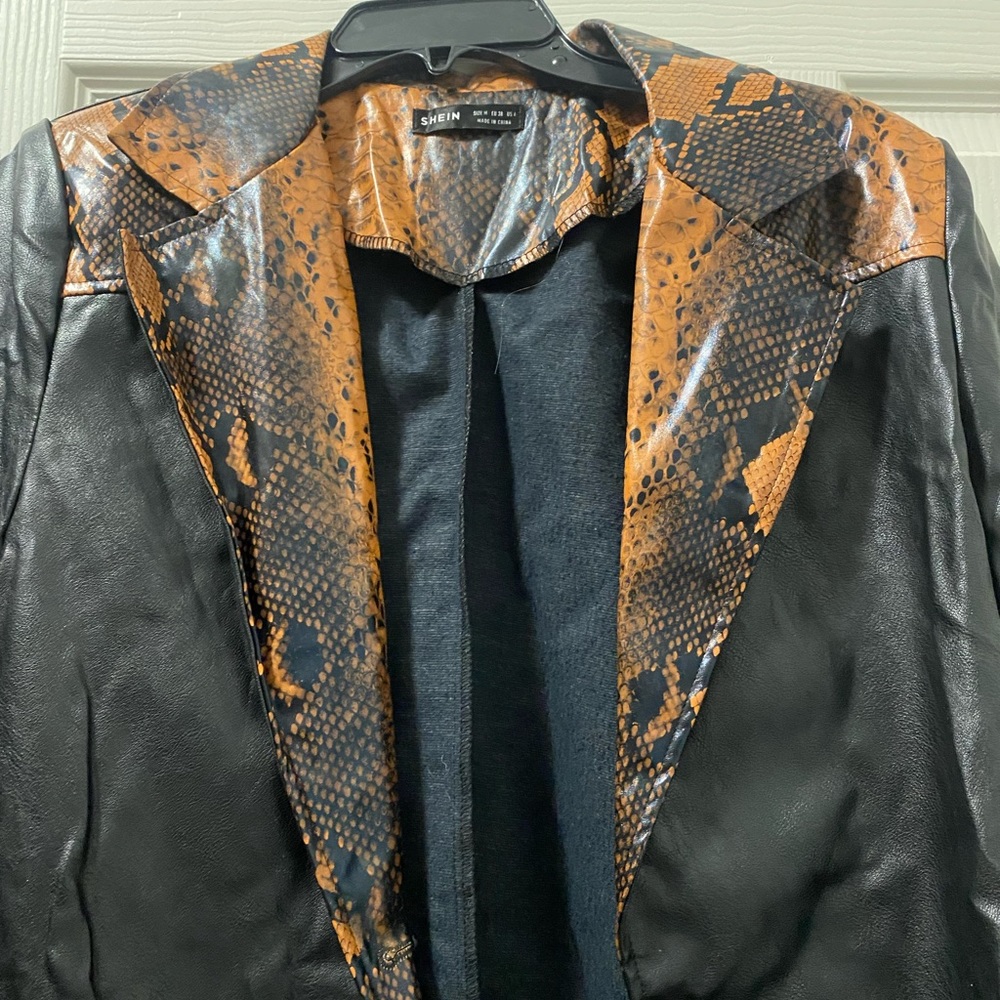 Pleather, print jacket. Great condition, like new! No defects, Medium size
